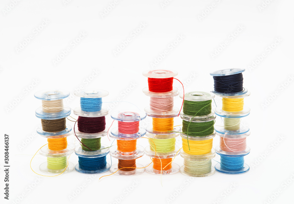Colorful bobbin thread isolated on white background. Colorful bobbin thread isolated on white background.