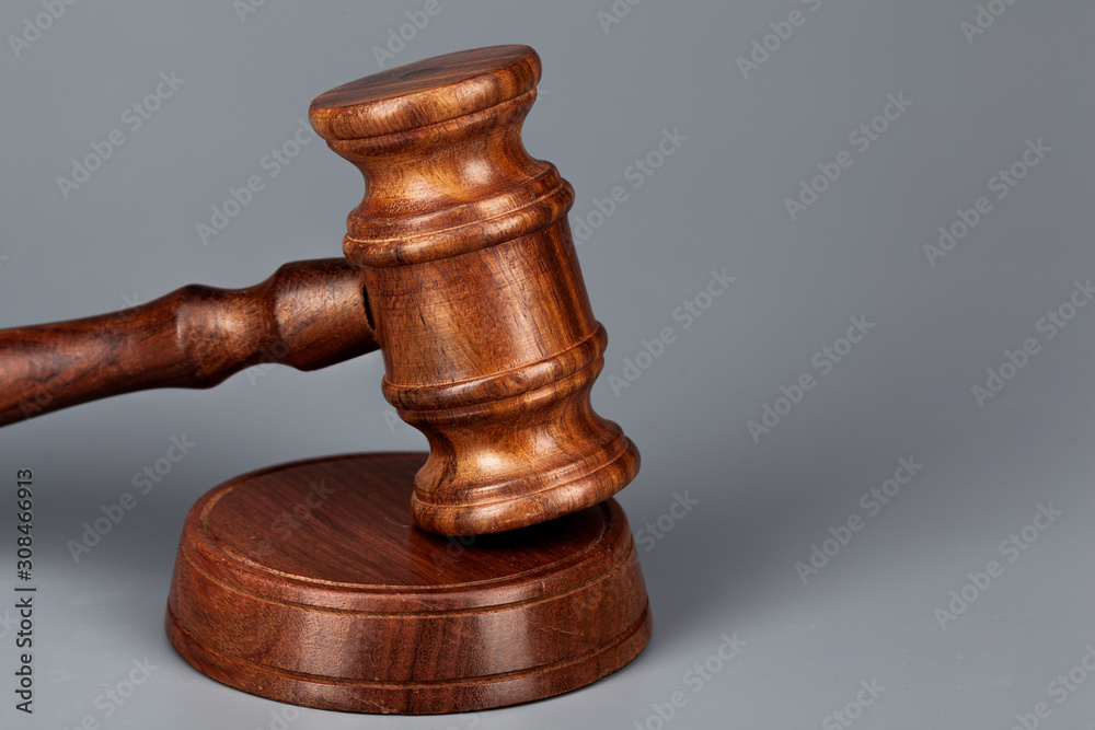 Wooden judges gavel on table close up Wooden judges gavel on table close up