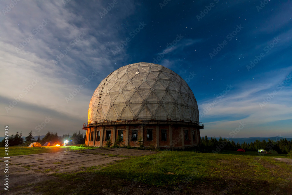Fototapeta premium Radar station geosphere on the starry sky background