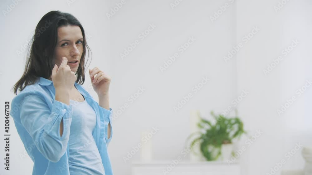 Slowmo. Brunette woman is showing indignation with facial expression and gestures, isolated, on white background. 4K. Slowmo. Brunette woman is showing indignation with facial expression and gestures, isolated, on white background. 4K.