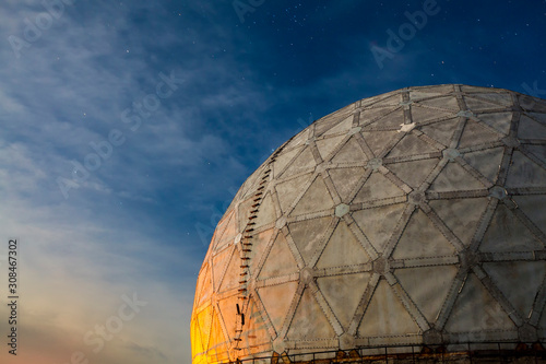 Radar station geosphere on the starry sky background
