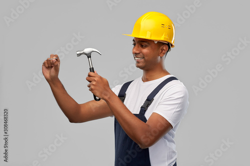 Obraz na plátně profession, construction and building - happy smiling indian worker or builder i