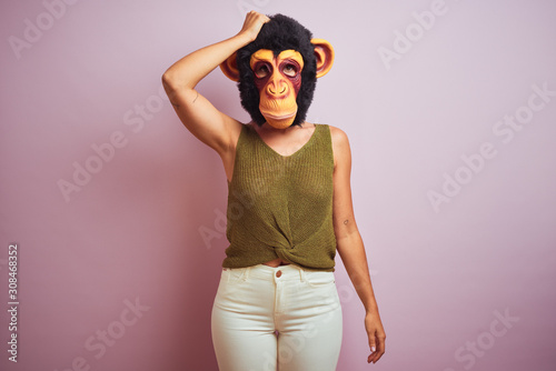 Photography Woman standing wearing t-shirt and monkey mask