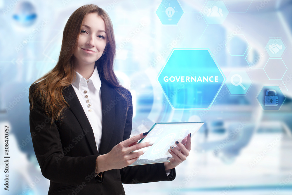 Business, Technology, Internet and network concept. Young businessman working on a virtual screen of the future and sees the inscription: Governance Business, Technology, Internet and network concept. Young businessman working on a virtual screen of the future and sees the inscription: Governance