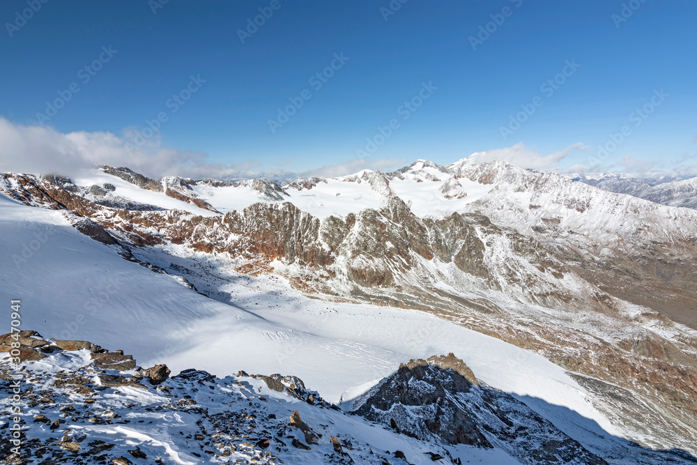 Snow-covered glaciers with rocky mountains at a sunny day. Oetztal Alps, Tirol, Austria