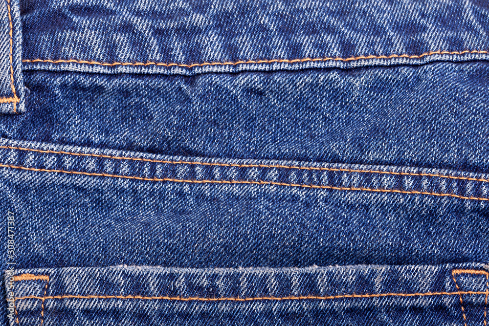 Blue denim jeans texture with seams. Blue denim jeans texture with seams.