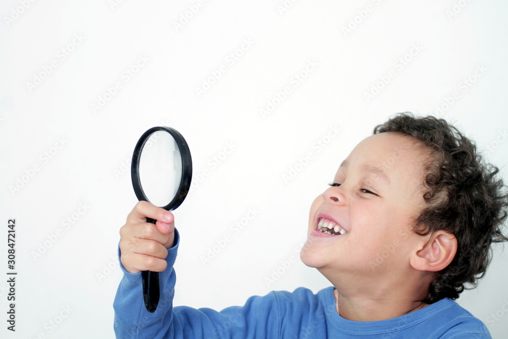 boy with magnifying glass ready to explore on white background stock photo boy with magnifying glass ready to explore on white background stock photo
