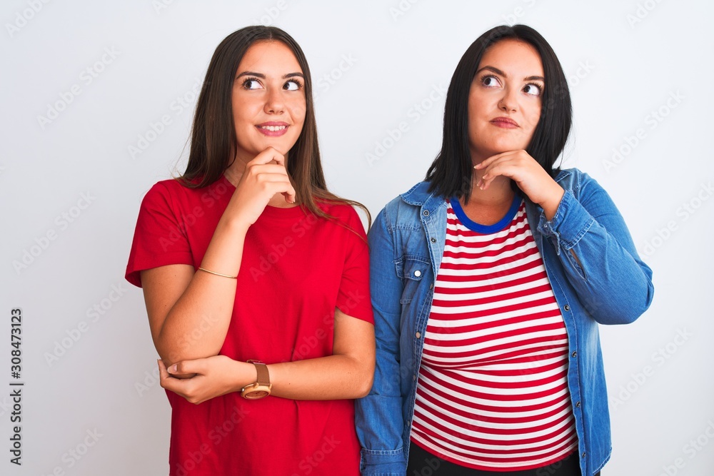 Young beautiful women wearing casual clothes standing over isolated white background with hand on chin thinking about question, pensive expression. Smiling and thoughtful face. Doubt concept. Young beautiful women wearing casual clothes standing over isolated white background with hand on chin thinking about question, pensive expression. Smiling and thoughtful face. Doubt concept.