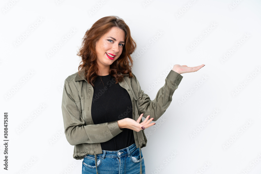 Young Russian woman over isolated white background extending hands to the side for inviting to come Young Russian woman over isolated white background extending hands to the side for inviting to come