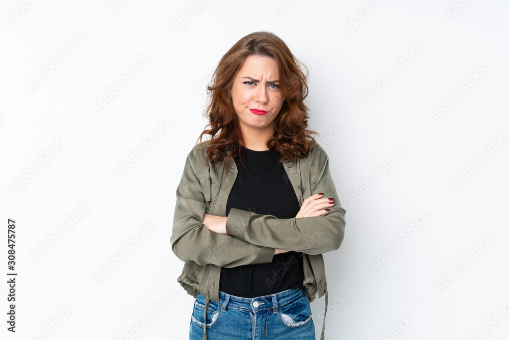 Fototapeta premium Young Russian woman over isolated white background feeling upset