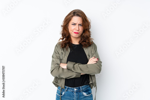 Young Russian woman over isolated white background feeling upset