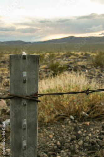 barbed wire fence in desert