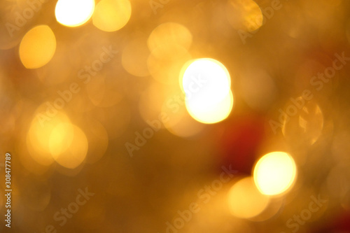 Gold blur abstract background. bokeh christmas blurred beautiful shiny Christmas lights, Christmas background concept.. © BoszyArtis