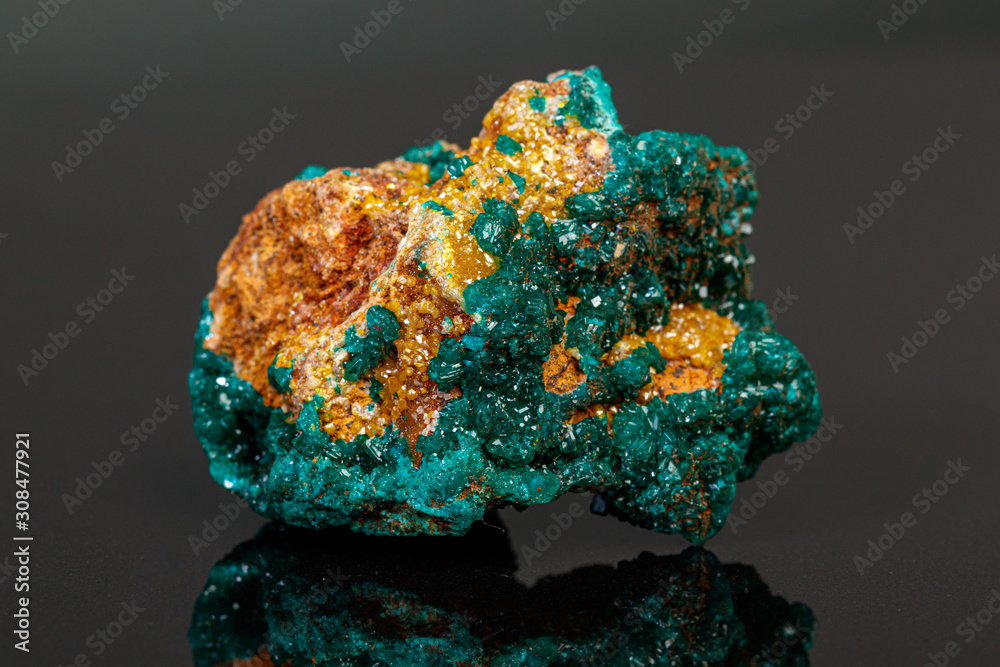 macro mineral stone Dioptase on a gray background macro mineral stone Dioptase on a gray background