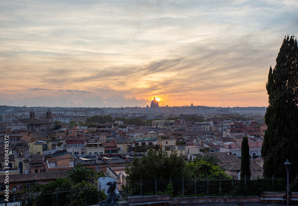 Panoramic view of Rome with St Peters Cathedral in the background during sunset