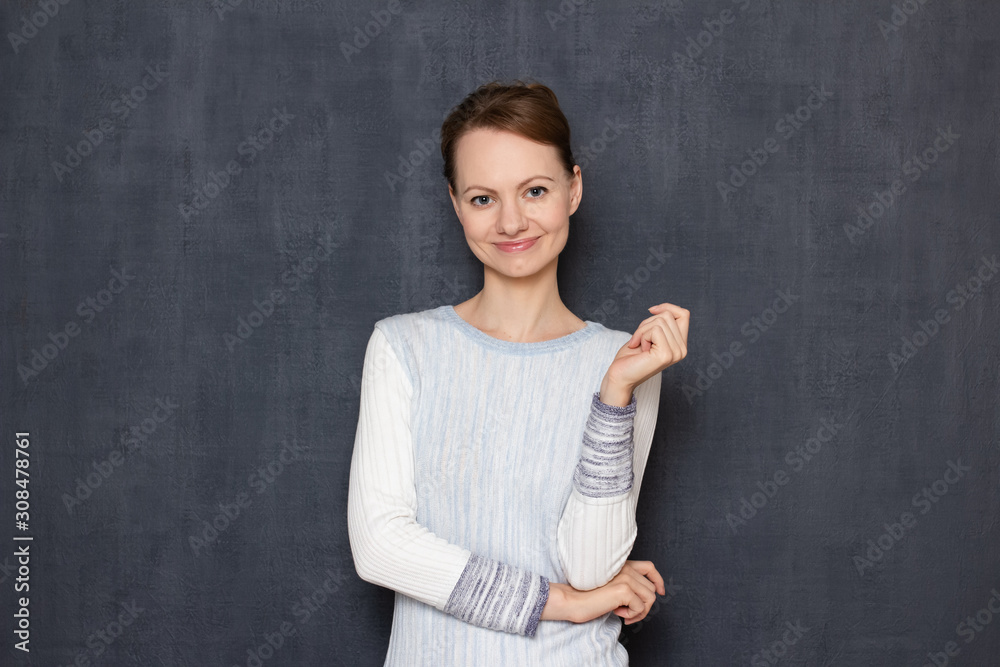 Portrait of happy satisfied cute girl standing in relaxed position Portrait of happy satisfied cute girl standing in relaxed position