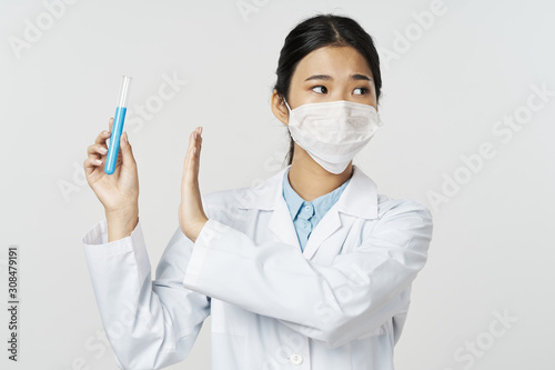 doctor in mask with syringe