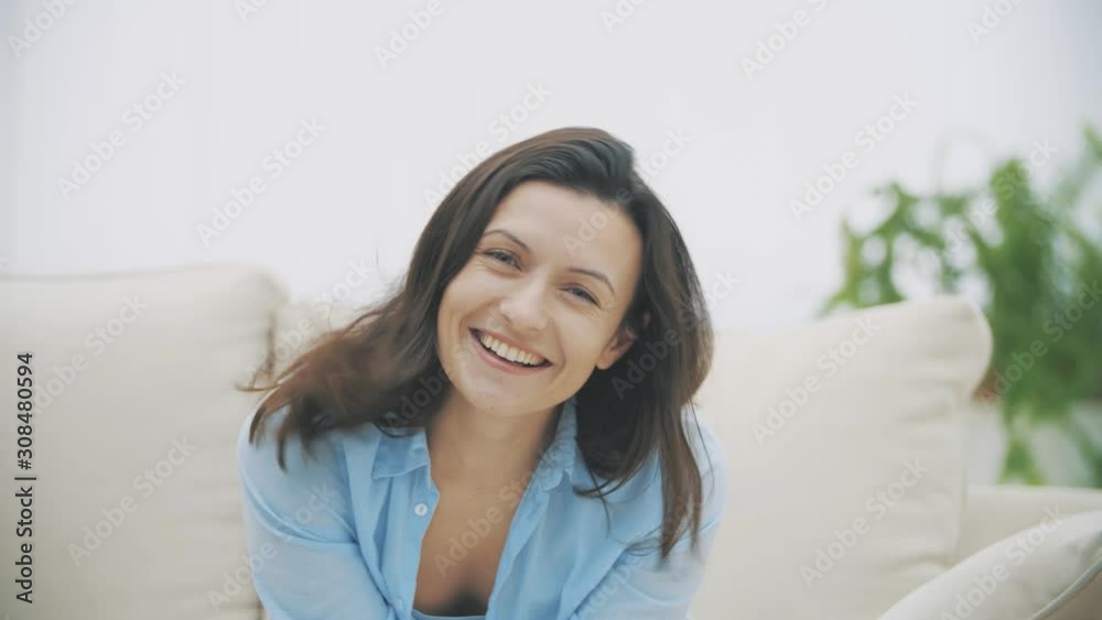 Beautiful pretty cute and funny woman is turning and waving her head, smiling widely and feeling fine. Woman is isolated on white background. Slow motion. 4K. Beautiful pretty cute and funny woman is turning and waving her head, smiling widely and feeling fine. Woman is isolated on white background. Slow motion. 4K.