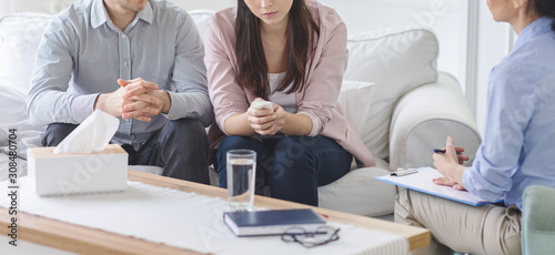 Cropped photo of couple visiting marital therapist photo