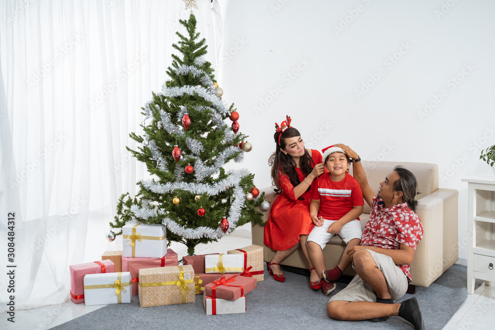 happy asian family having fun at home on christmas day