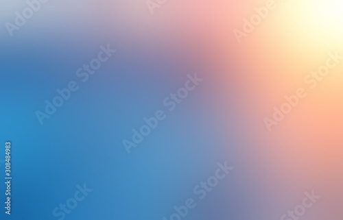 Bright sun light on empty background. Winter sky blurred abstract illustration. Blue red yellow transition defocused pattern.