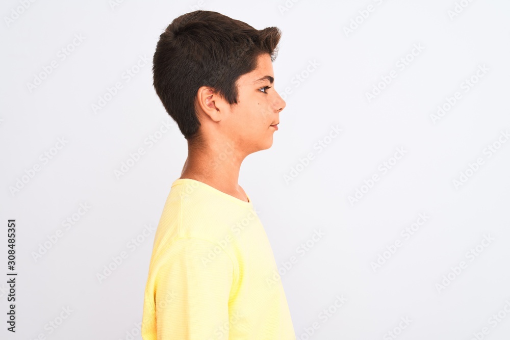 Handsome teenager boy standing over white isolated background looking to side, relax profile pose with natural face with confident smile. Handsome teenager boy standing over white isolated background looking to side, relax profile pose with natural face with confident smile.