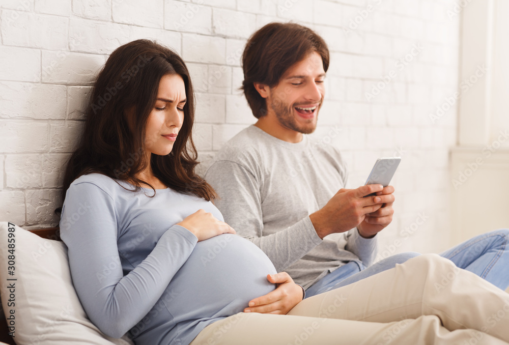 Husband ignoring his pregnant wife that suffering belly ache at home Husband ignoring his pregnant wife that suffering belly ache at home