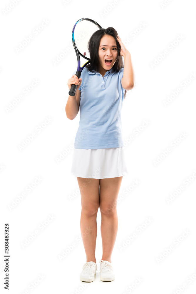 Young asian tennis player over isolated white background with surprise and shocked facial expression Young asian tennis player over isolated white background with surprise and shocked facial expression