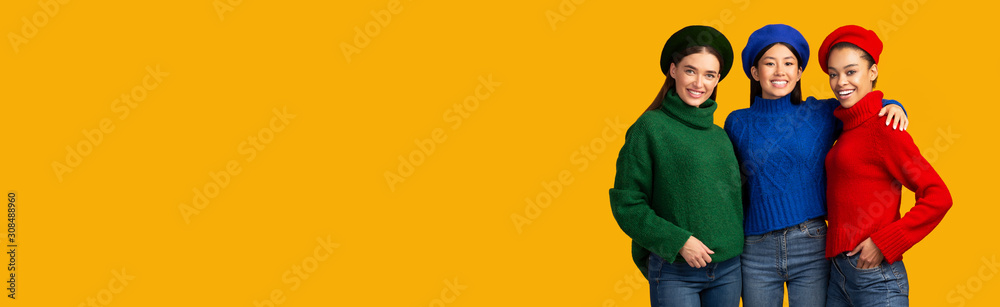 Multiethnic Girls Hugging Looking At Camera Over Yellow Background, Panorama Multiethnic Girls Hugging Looking At Camera Over Yellow Background, Panorama