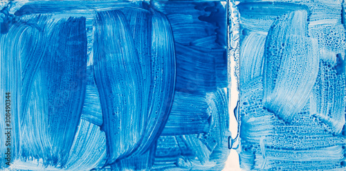 Art abstract background - blurry blue paint smears & watery brushstrokes, as a creative texture / design / panorama.