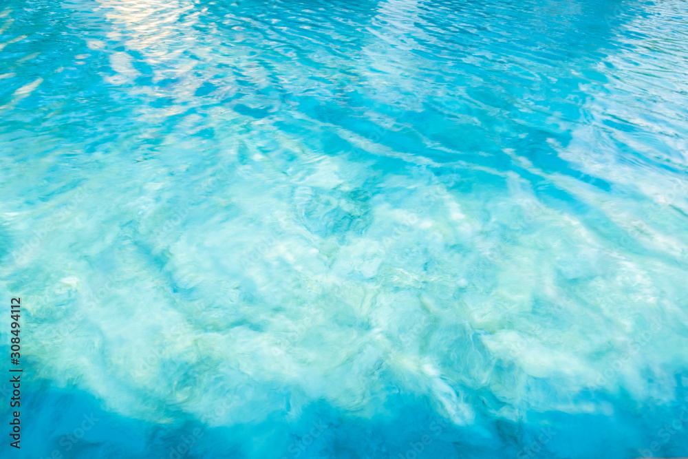 Fototapeta premium pure water surface blue ocean color scenery soft background with beautiful white sunlight glitter bokeh