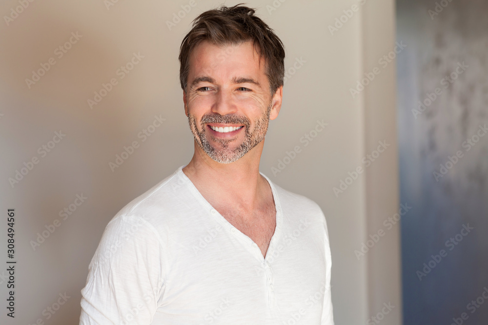 Portrait of a mature man smiling. Looking away. Really happy Portrait of a mature man smiling. Looking away. Really happy