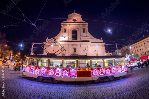 Christmas special tram illuminated by light with Christmas motif in Brno on traditional Moravian markets. photo