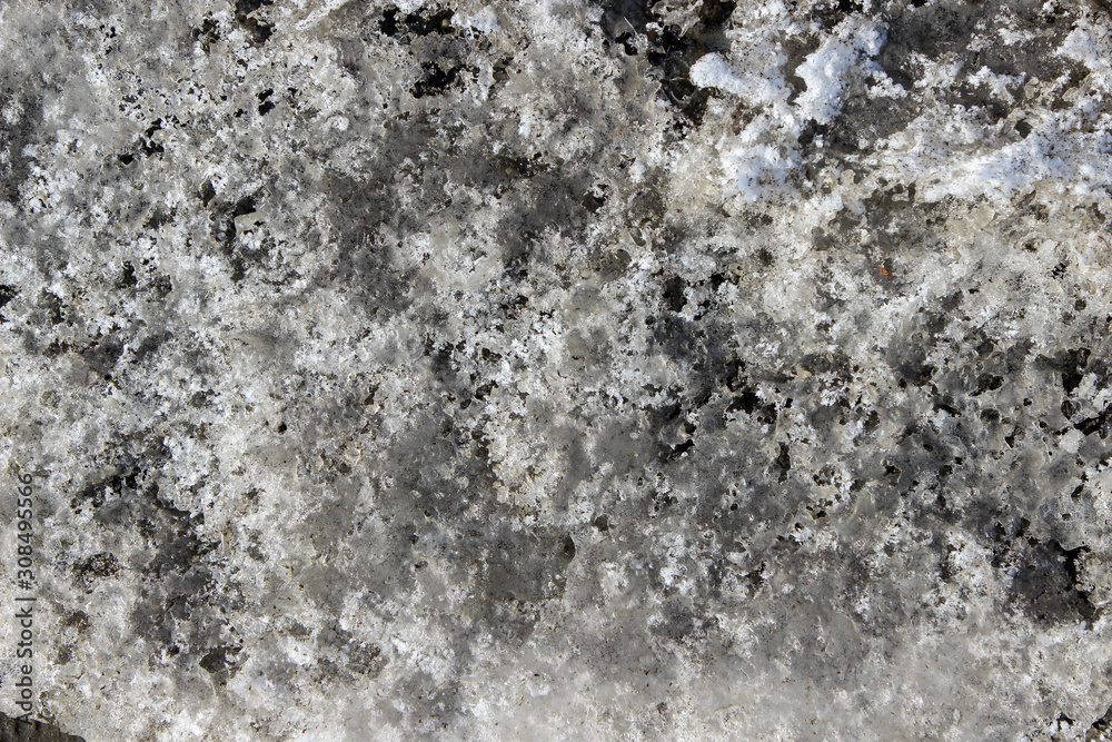 Obraz premium Texture of a dirty heavy jagged melting snow turning into ice 