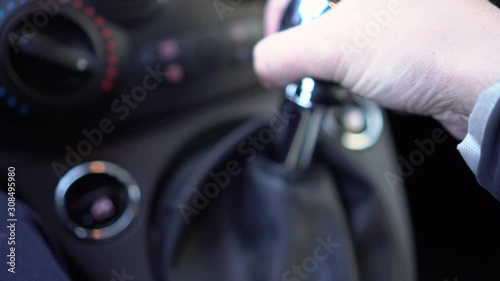 Man Hand Changing Gear Fast during a Race photo