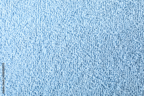 Blue towel textured background, closeup and space for text