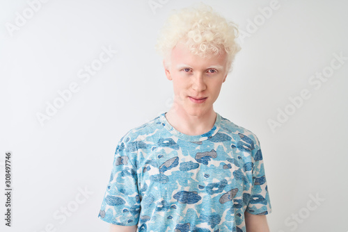 Young albino blond man wearing casual t-shirt standing over isolated white background with serious expression on face. Simple and natural looking at the camera.