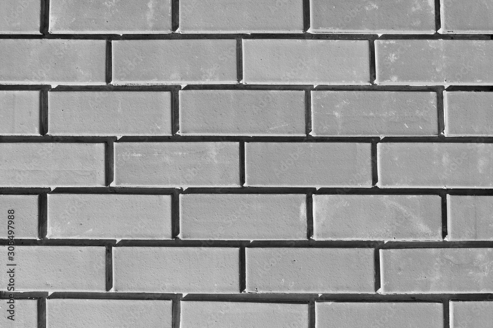 The texture of the new brickwork. Bricks background for design template. Brick wall. Close-up. The texture of the new brickwork. Bricks background for design template. Brick wall. Close-up.