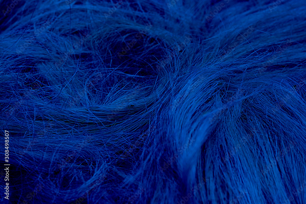 Fototapeta premium Rough natural raw plant fiber. Detail, closeup. Horizontal. Wallpaper and background about fabtic manufacture, eco friendly material and textile industry Classic, blue monochrome, trend 2020