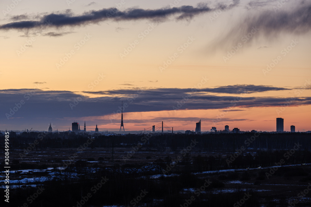 dramatic winter sunrise over city of Riga in Latvia