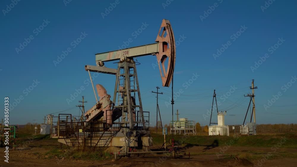 Oil production, oil pumping at dawn Oil production, oil pumping at dawn