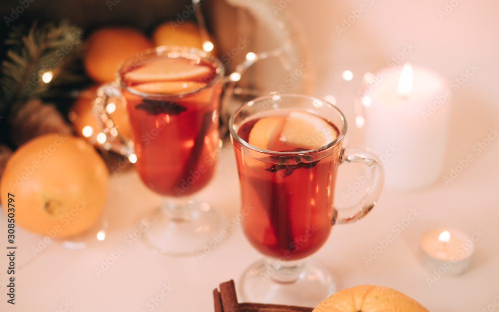 Atmospheric Christmas or New Year background with mulled wine. Close up of mulled wine, soft focus, shallow depth of field Atmospheric Christmas or New Year background with mulled wine. Close up of mulled wine, soft focus, shallow depth of field