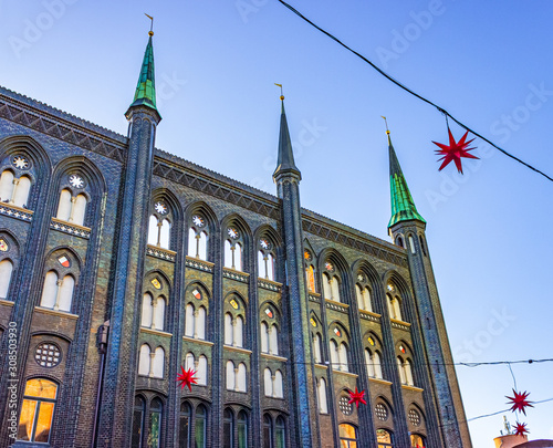 Fascinating renaissance wall of city hall Lübeck, Germany, with Christmas lights