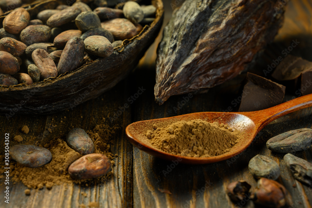 open cocoa fruit lies on wooden table open cocoa fruit lies on wooden table