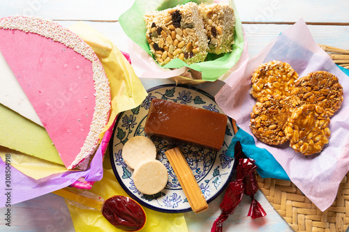 Group of mexican candies on wooden background photo