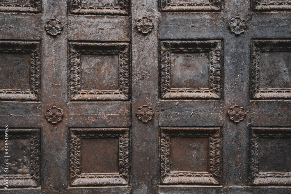 Black wrought iron openwork vintage metal doors