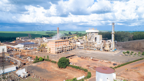 Sugar cane industrial mill processing plant in Brazil. Sugarcane plant producing renewable energy. Ethanol. photo