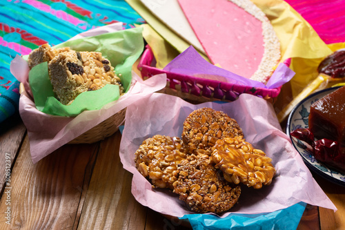 Group of mexican candies on wooden background photo