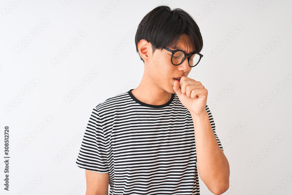 Chinese man wearing glasses and navy striped t-shirt standing over isolated white background feeling unwell and coughing as symptom for cold or bronchitis. Healthcare concept.