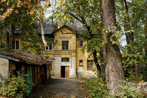 old house in the surrounded by trees © Alex Behemodoff